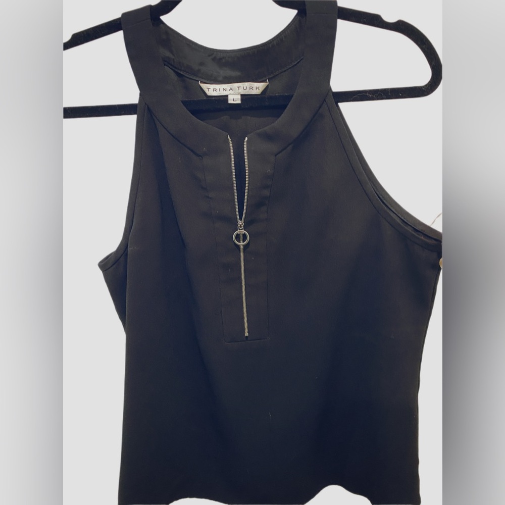 Trina Turk flowy little black blouse. Sleeveless with cool zipper detail.
